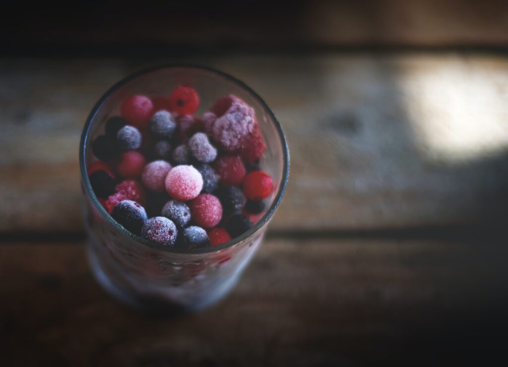 A glass with frozen fruits